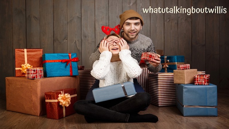 Young man surprises woman with whatutalkingboutwillis gifts surrounded by Christmas presents.